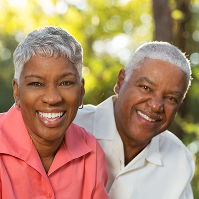 Senior couple smiling outdoors