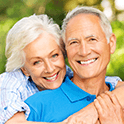 Senior couple smiling together outdoors